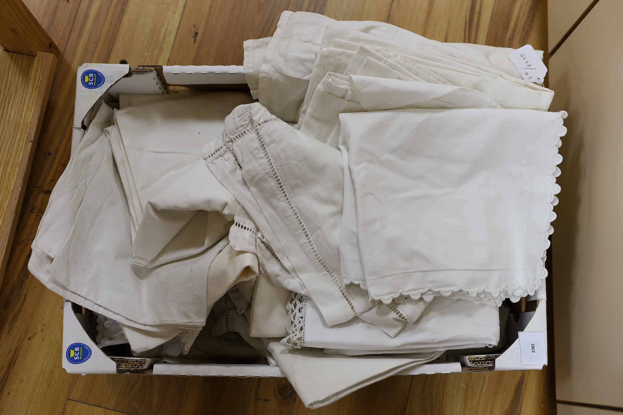 A box of French Provincial linen embroidered pillowcases